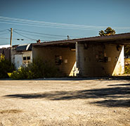 A vulnerable steel enclosure at a self-service car wash